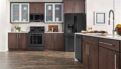 brown wood floor black cabinets and stainless steel appliances|black stainless steel kitchen cabinets colors.